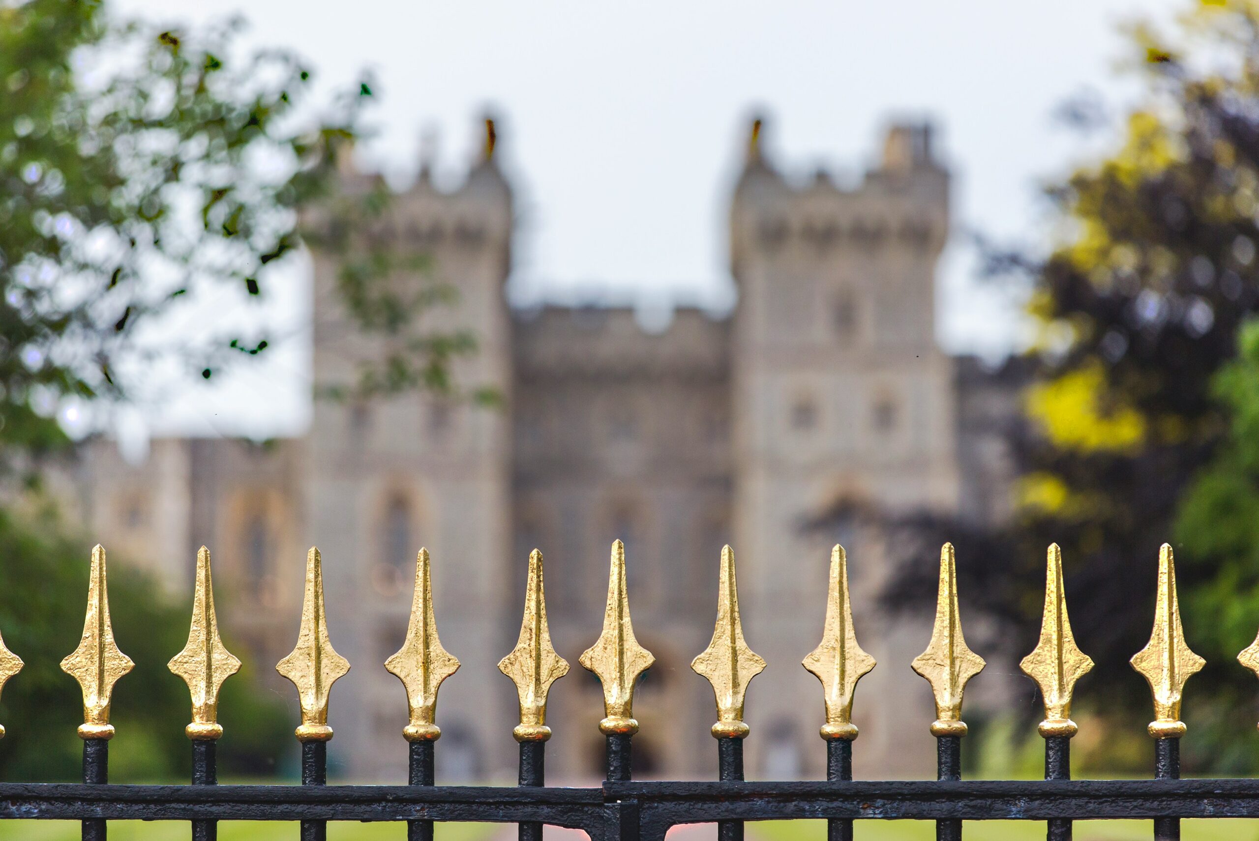 black metal fence in front of mansion