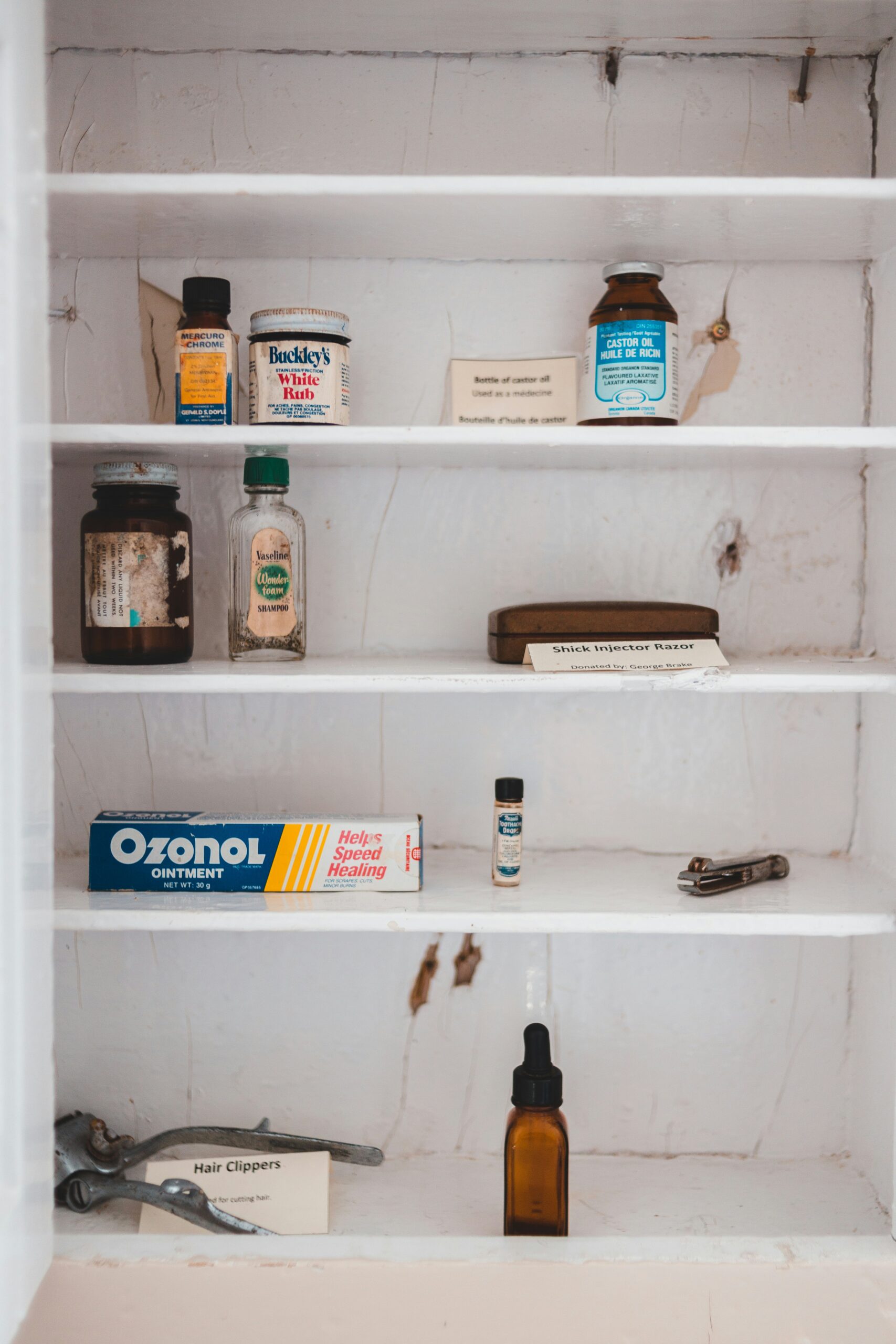 white wooden shelf with bottles